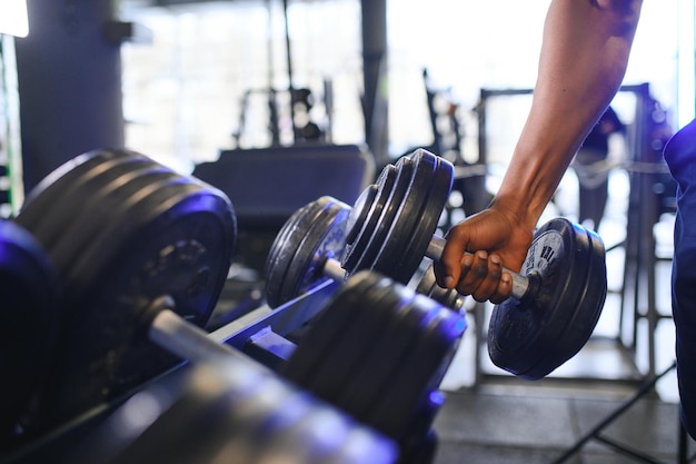 Hand holding dumbbell Close up