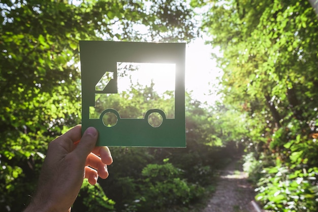 Hand holding eco friendly green living symbol