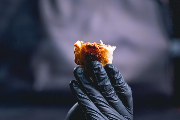 hand holding an empanada from argentina