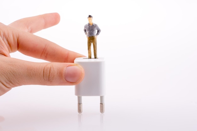 Hand holding a figure on an adapter