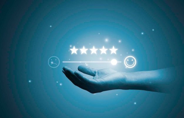 Hand holding glowing five stars with smile face icon from client excellent evaluation after use product and service concept