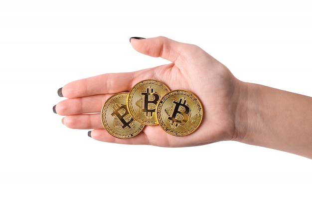 Hand holding golden Bitcoin