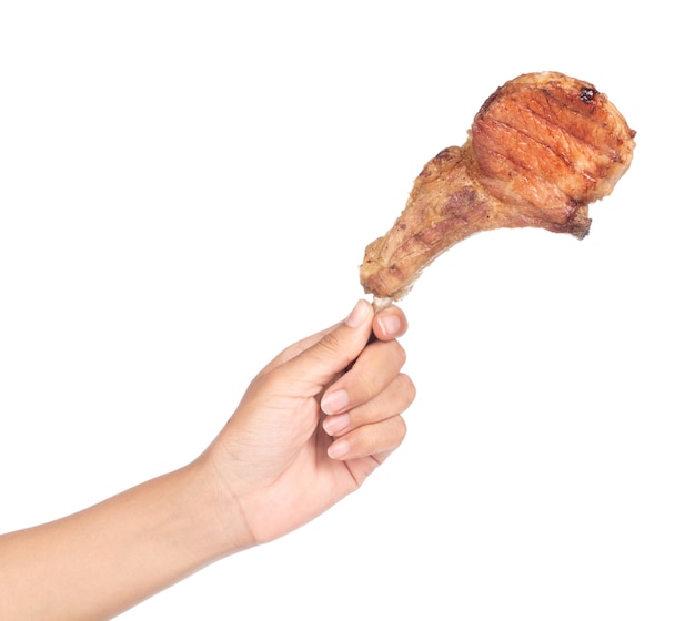 hand holding Grilled pork ribs isolated on white background