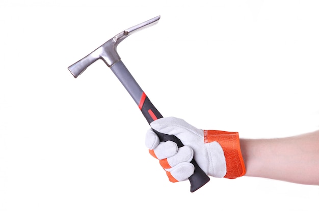 The hand holding the hammer isolated on a white 