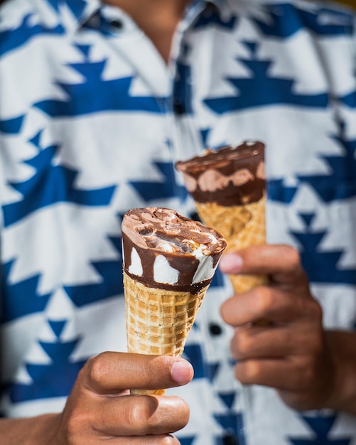 Hand holding ice cream cone