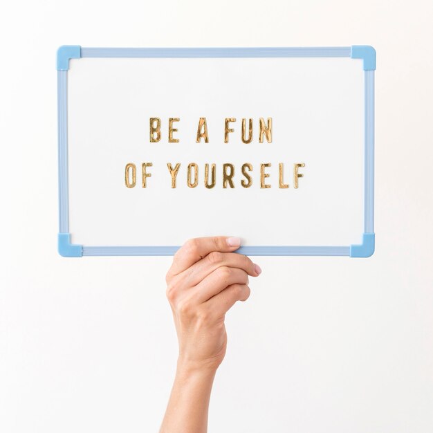 Photo hand holding inspirational message board
