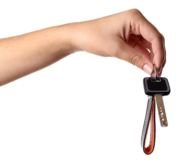 Hand holding key with strap isolated on white