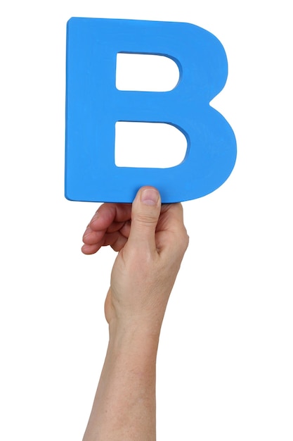 Hand holding letter B from alphabet