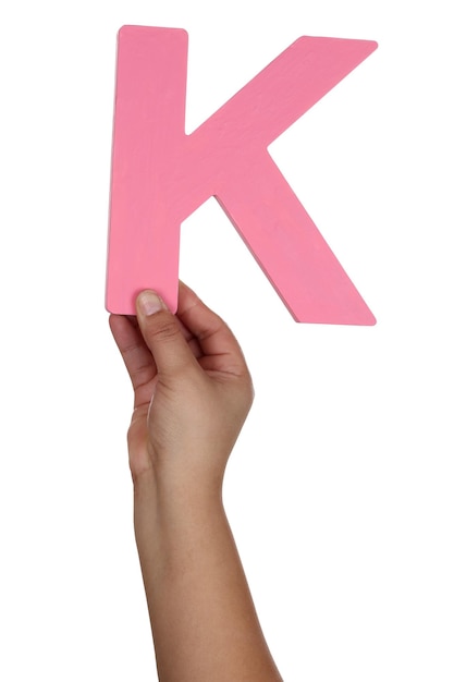 Photo hand holding letter k from alphabet