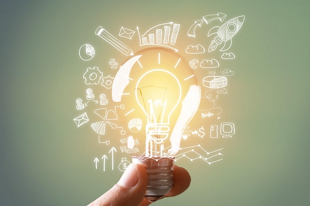 hand holding light bulb with illustration