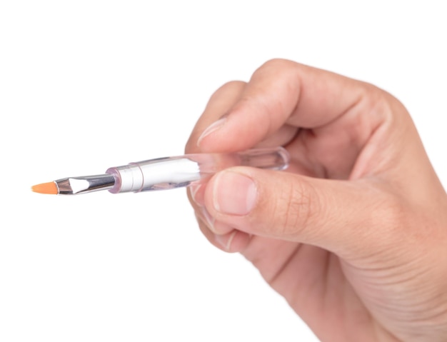 Hand holding Lip brush isolated on white background.