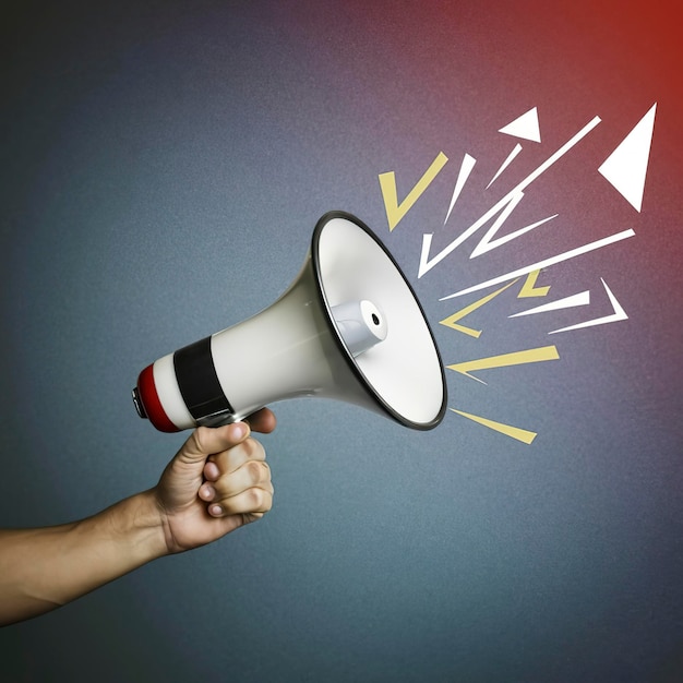 Hand holding megaphone on gradient background ads and sales concept