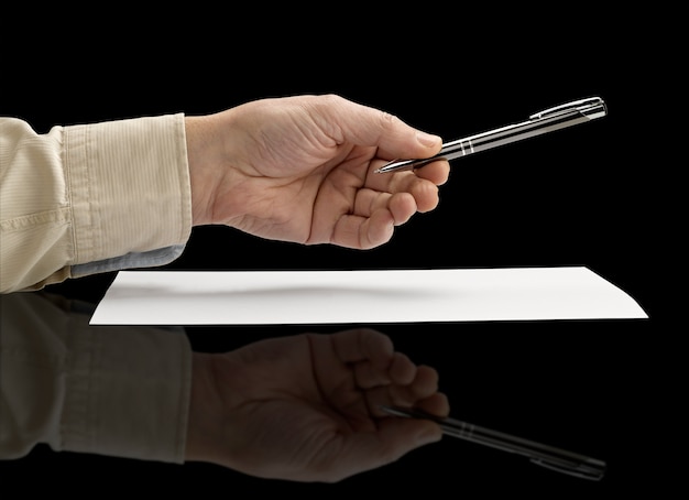 Hand holding a metal pen (clipping path)