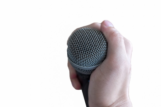 Hand holding a microphone, isolated on white background