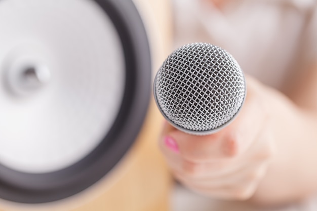 Hand holding the microphone