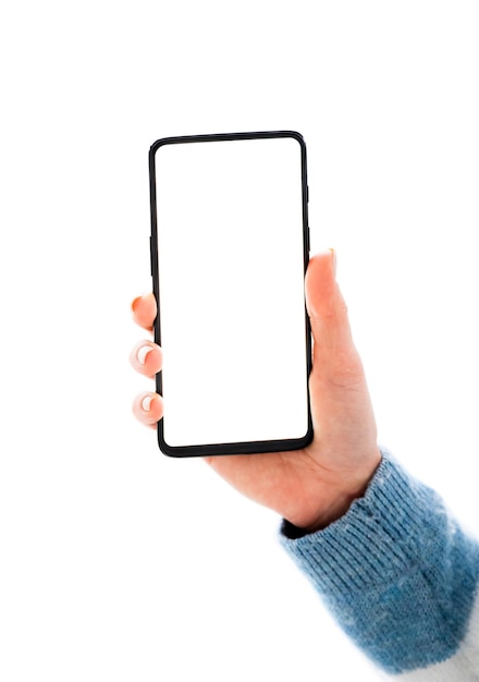 Hand holding mobile phone with white screen isolated on a white background