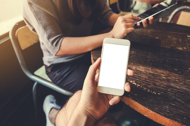 Hand holding mockup smart phone