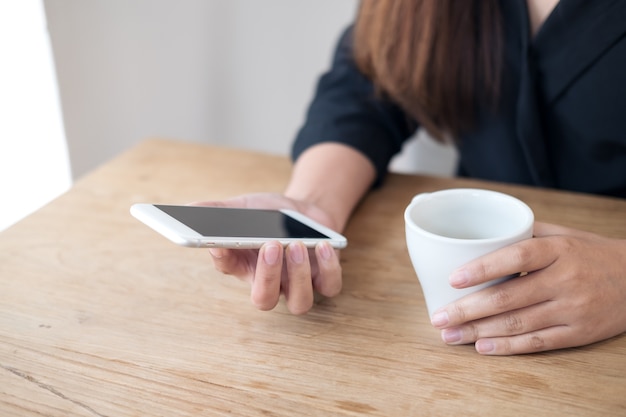 Hand holding mockup smart phone