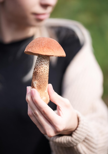 Hand holding mushrooms