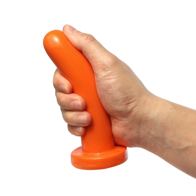Foto una mano che tiene un manico arancione con sopra la parola 