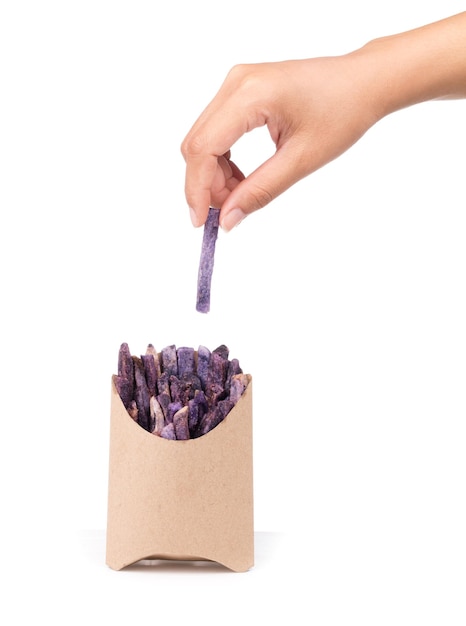 hand holding paper bag of fried taro snacks isolated on white background