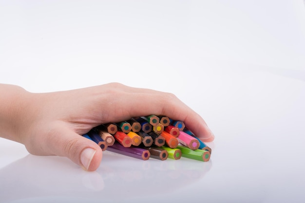 Hand holding pencils