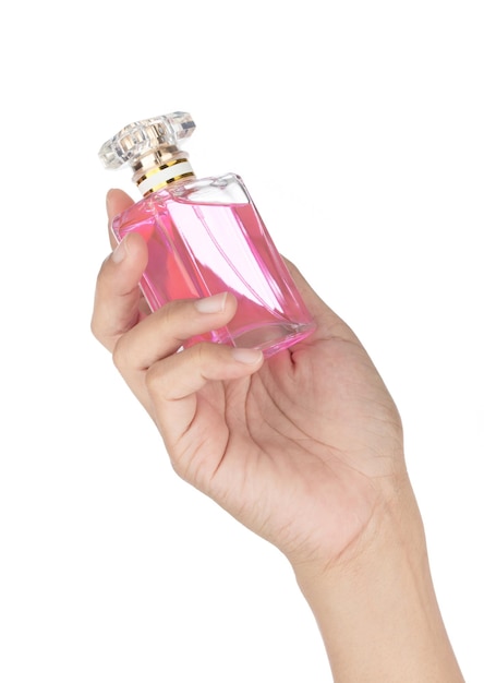 白い背景に分離された香水ガラス ボトル化粧品ボトルを持っている手。