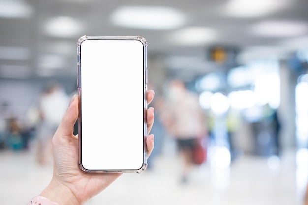 A hand holding a phone with a blank screen