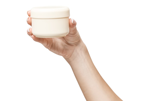 hand holding plastic can of cream Isolated  