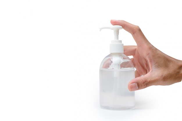 Hand holding and press a bottle alcohol gel for washing hands and prevent corona virus (Covid-19)