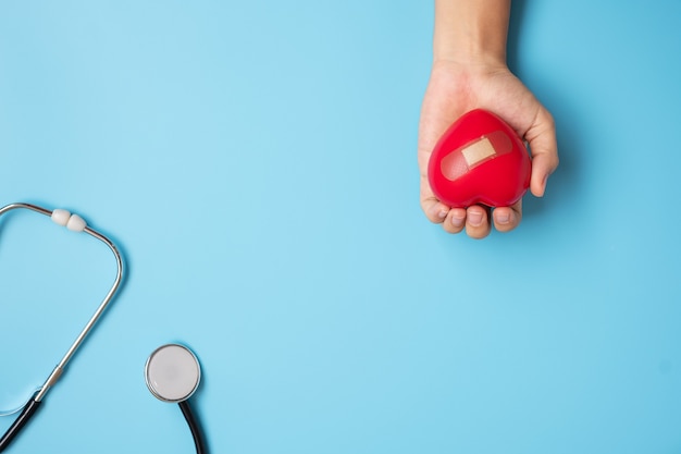 hand holding Red heart shape with Stethoscope 