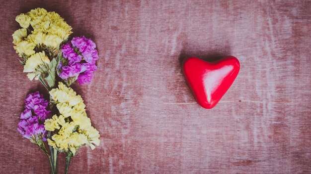 hand holding a red heart, valentine's day love, vintage tone 