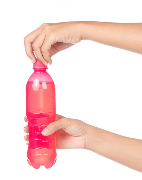 Photo hand holding refreshing strawberry soda soft drinks in bottle isolated on white background