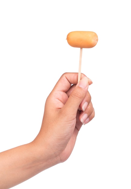 hand holding sausages on wooden stick isolated on white background