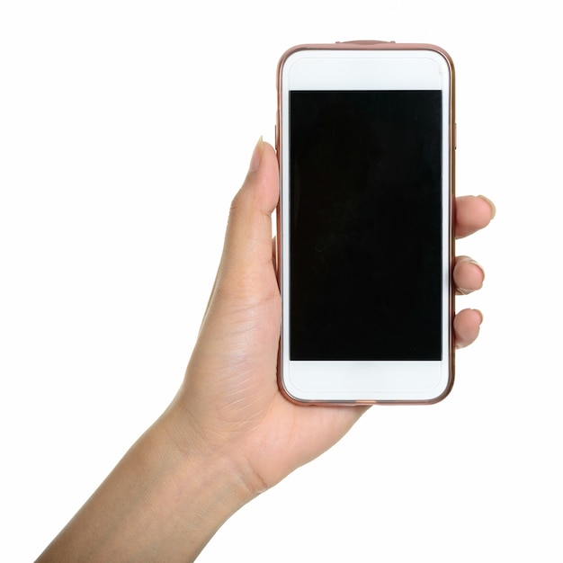 hand holding smart phone against white wall