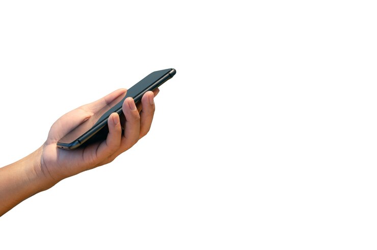 Photo hand holding smart phone isolated on white background.