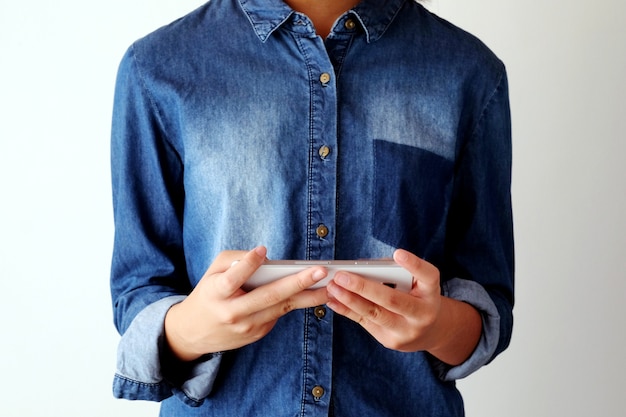 Hand holding smart phone on white background