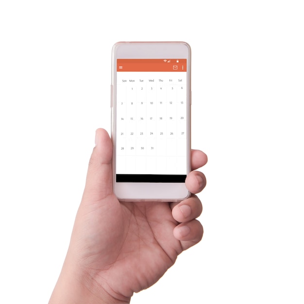 スケジュールとスマートフォンを持っている手