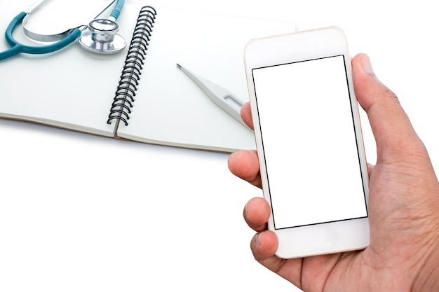 hand holding a smartphone on a medical instrument background