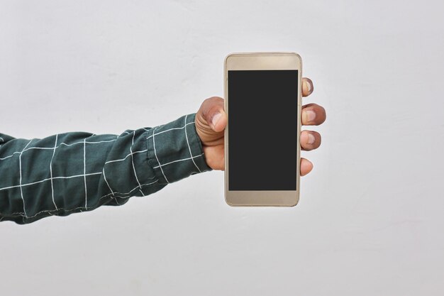 Photo hand holding a smartphone on a white background