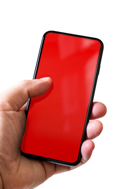 Hand holding a smartphone with blank red screen Isolated on white