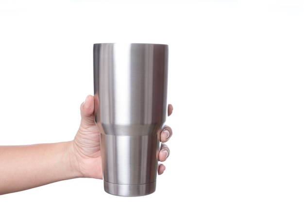 Hand holding stainless steel thermos mug for keeping  temperature like iced of hot water