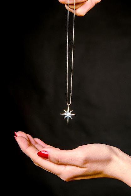 a hand holding a star that has a star on it