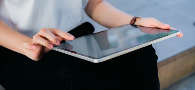 Hand holding tablet blank screen on isolated.