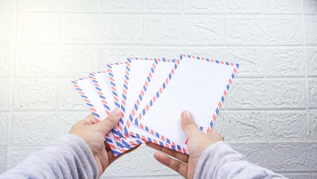 Hand holding The THR envelope contains Indonesian money THR is a holiday allowance on Eid alFitr