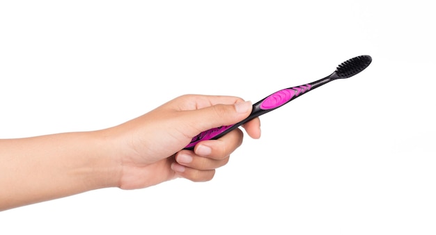 hand holding toothbrush isolated on white background