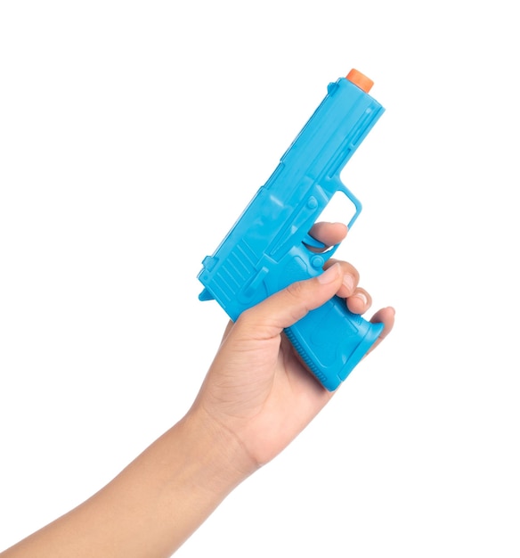 hand holding Toy Gun made of plastic isolated on white background