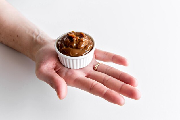 Hand holding Traditional dulce de leche