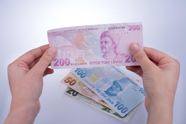 Hand holding Turksh Lira banknote in hand