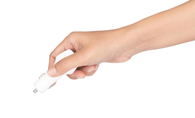 hand holding usb car charger on white background.